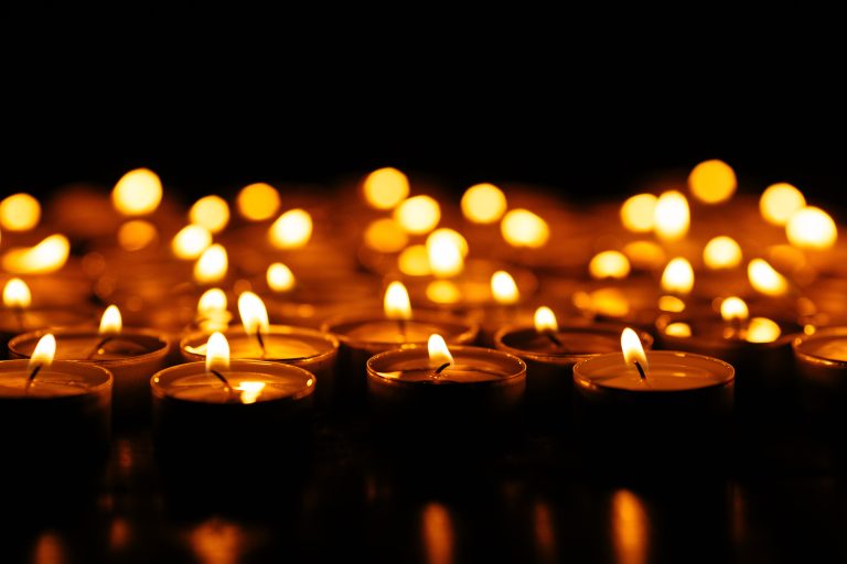Candles. Set of lighting candles in dark